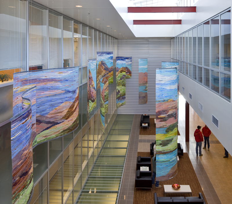 
        From the balcony end of the space, the landscape floats above the glass floor to the sub story below.        