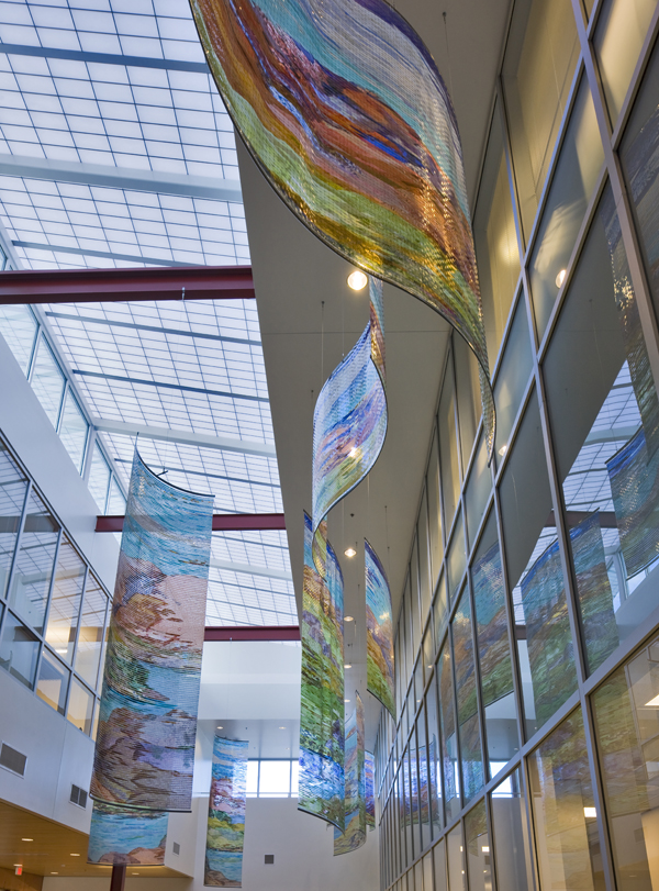 
        Depending on the light, each unit will reflect in reverse against the floor to ceiling glass wall.        