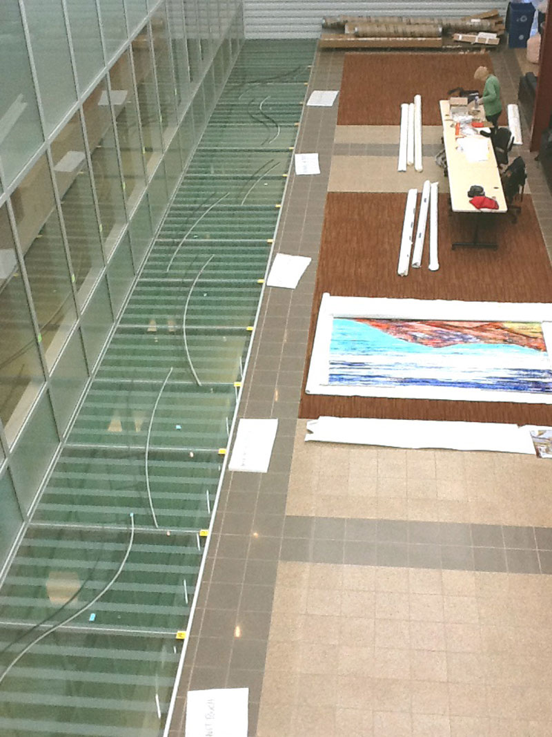 
        All of my art work and the steel was shipped from my studio in Maine to the Lab in Albuquerque for installation. Here, I laid out the steel on the glass floor, getting ready for installation crew to arrive.
        
